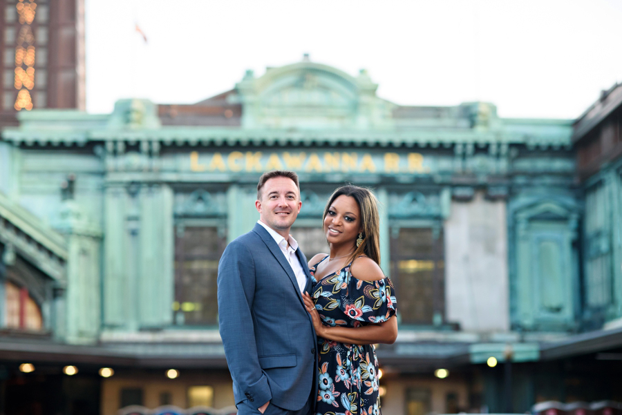 A couple in front of the Lackawanna train station in Hoboken, NJ.